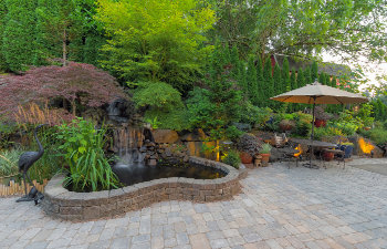 backyard garden landscaping with waterfall pond trees plants trellis decor furniture brick pavers patio hardscape, 