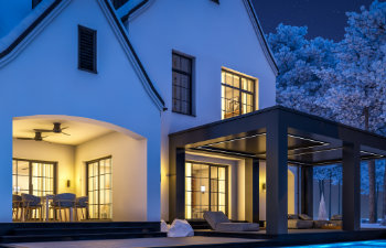 white and black modern tudor house in winter night